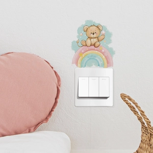 Self-adhesive cartoon rainbow bear wall sticker for light switch in a kids' bedroom