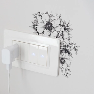Détail d'un sticker mural fleuri moderne minimaliste autour d'un interrupteur de lumière