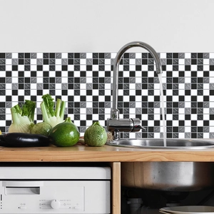 Waterproof black and white checkerboard tile stickers applied to a kitchen backsplash area