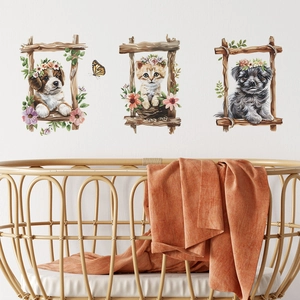 Nursery wall art with three watercolor animal prints and wicker crib in cozy room setup