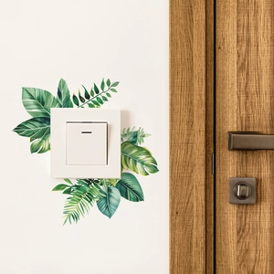 Tropical green leaf wall stickers for light switch decoration in a modern living room