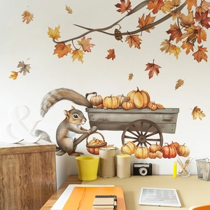Autumn wall decals with cartoon squirrel and pumpkin cart on white living room wall