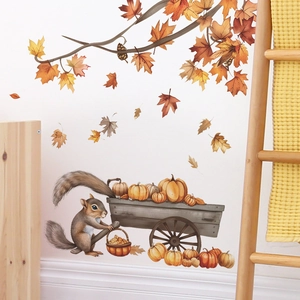 Detail view of cartoon squirrel wall sticker with pumpkins and autumn maple leaves