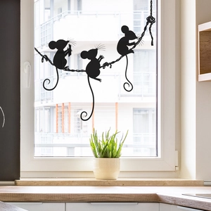 Black silhouette cartoon mice playing on a rope wall sticker on a kitchen window