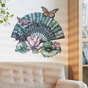 Detail of Chinese style lotus and fan wall stickers on a white wall above a sofa