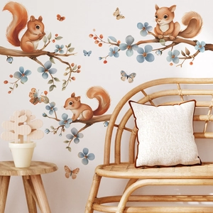 Nursery wall decals featuring cartoon squirrels and branches for bedroom decor