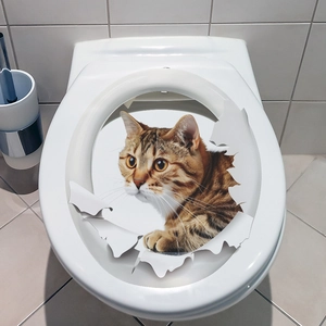 Detailed 3D cat wall sticker showing a tabby cat peeping through a torn paper hole on a toilet
