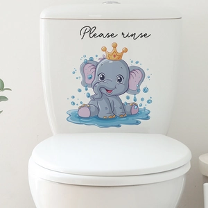 Dettaglio adesivo per WC con elefante e testo 'Please rinse' su serbatoio in ceramica