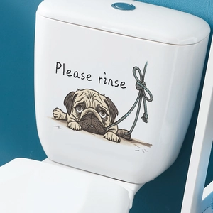 Close-up of cute pug cartoon sticker with Please Rinse text on white toilet tank