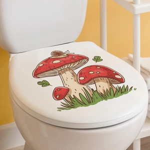 Close-up of a self-adhesive toilet lid sticker with colorful mushroom and snail patterns