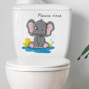 Dettaglio dell'adesivo per WC elefante con testo Please rinse su WC bianco
