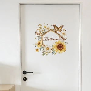 Detail view of watercolor sunflower and butterfly bathroom wall sticker on a white door