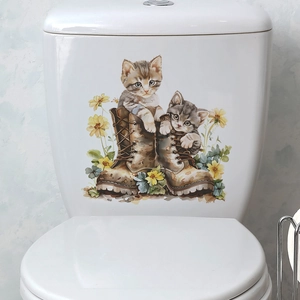 Watercolor cat and flower decal applied to a white ceramic toilet tank in a bathroom
