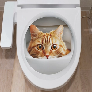 3D orange tabby cat toilet sticker showing a funny peeking kitten in a modern bathroom