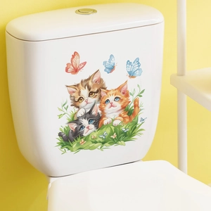 Detail of cute cartoon kittens and butterflies sticker on a white ceramic toilet tank