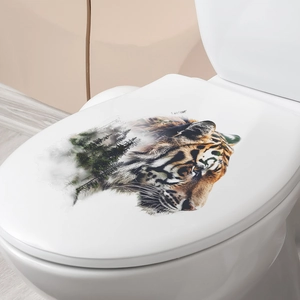 Detail of tiger head and pine forest silhouette wall sticker applied on a white toilet lid