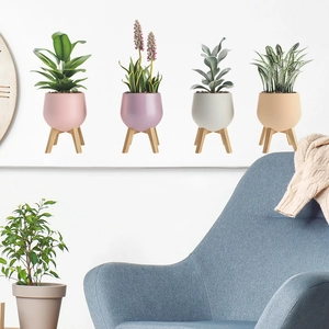 Set of four creative potted plant wall stickers with wooden tripod stand designs