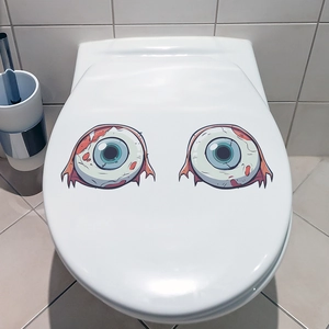 Close-up of spooky bloodshot eyeball stickers for Halloween bathroom toilet decor