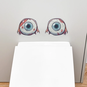 Detail of Halloween bloodshot eyeball stickers with realistic blue iris on a white surface