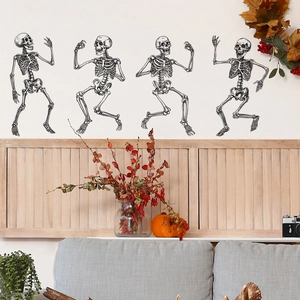 Set of 4 dancing skeleton wall decals for Halloween home decoration on a white wall