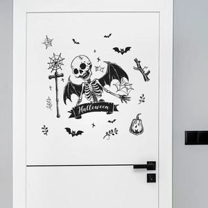 Halloween wall decals featuring skull wings, bats and spider webs on a white door