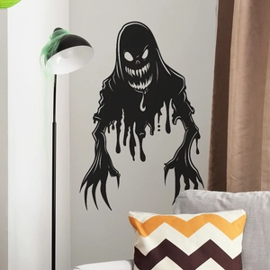 Black ghost wall sticker silhouette for Halloween home decor in a cozy living room setting