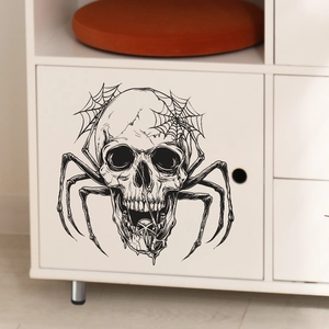 Gothic skull and spider web decal sticker applied on a white minimalist cabinet surface