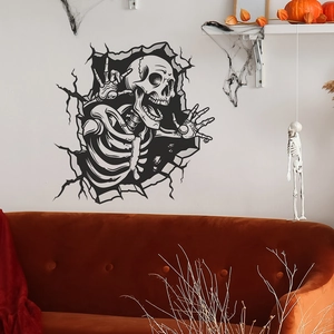 3D Halloween wall decal featuring a skull breaking through the wall for festive decor
