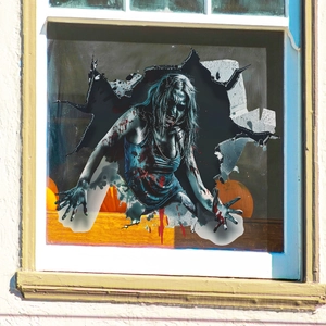 Realistic 3D Halloween wall sticker showing a creepy zombie girl breaking through glass