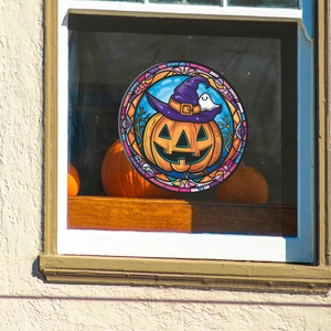 Close-up of circular Halloween window cling with wizard pumpkin in stained glass style