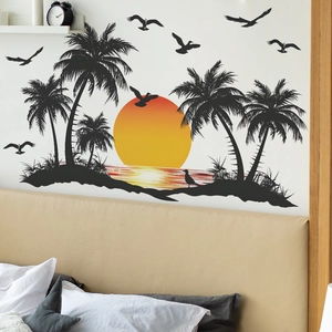 Tropical sunset wall decal featuring coconut trees and gulls silhouettes in a bedroom