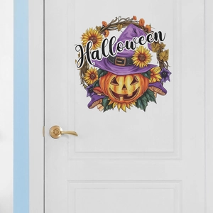 Detail view of a Halloween pumpkin wall sticker with sunflowers on a white door