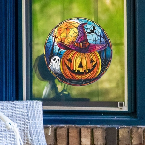 Round Halloween window sticker with pumpkin and ghost motifs on glass window surface
