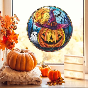 Close-up of Halloween window sticker with pumpkin and ghost in a cozy home setting