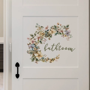 Floral bathroom door decal with watercolor flowers on a white wooden door surface