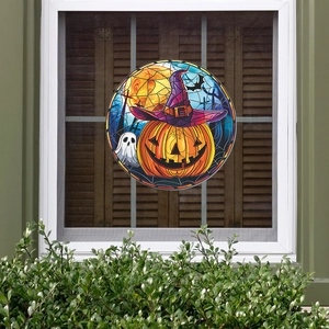 Detail of round Halloween window sticker with colorful stained glass pumpkin and ghost design