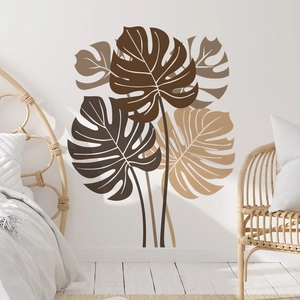 Detail view of tropical monstera leaf wall decals in earthy brown and beige tones