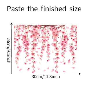Detail of pink cherry blossom wall decal measuring 30cm wide by 23cm high on white background