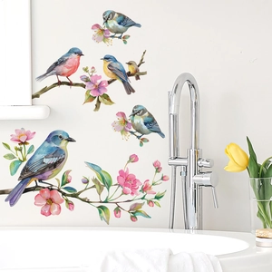 Detail of colorful birds and cherry blossom wall stickers in a modern bathroom setting