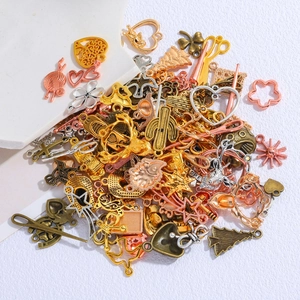 Assorted vintage alloy charms in gold silver and bronze for DIY jewelry making kits