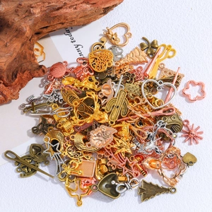 Assorted vintage alloy charms in gold and silver for DIY jewelry making and crafting