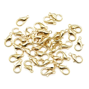 Close-up of golden zinc alloy lobster clasps for DIY jewelry necklace making