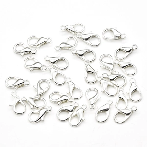 Macro detail of high-quality silver lobster clasps for DIY jewelry making and necklace crafts