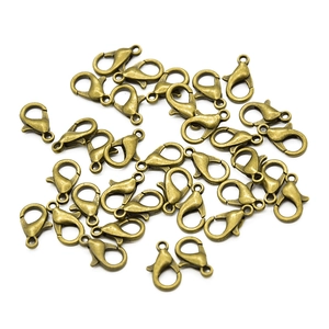Detailed macro view of antique bronze lobster clasps for DIY necklace making