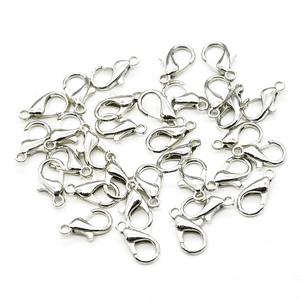 Close-up of silver zinc alloy lobster clasps for DIY jewelry making and necklace repairs