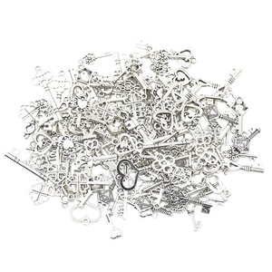 Detailed close-up of mixed silver vintage alloy keys with heart and LOVE motifs