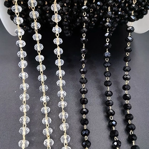 Crystal beaded chain on white spool for DIY jewelry making in black and clear colors