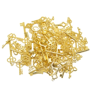 Macro view of assorted golden vintage alloy key pendants with LOVE engraving