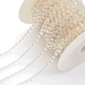 DIY crystal beaded chain with gold metal wire on white spool for jewelry making