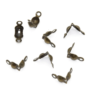 Macro shot of bronze metal bead tips for DIY jewelry making and necklace finishing